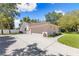 This home features a spacious garage with a large driveway, side entrance, and manicured lawn at 7222 Stanford Dr, Lakeland, FL 33809