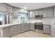 This modern kitchen offers stainless appliances, sleek cabinetry, counter space, and a sunlit window at 7222 Stanford Dr, Lakeland, FL 33809