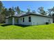 Lush green lawn surrounds this well-maintained home at 814 Gator Ln, Deltona, FL 32738