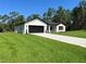 Well-kept single-Gathering home with an attached garage, lush lawn, and beautiful landscaping in a desirable neighborhood at 814 Gator Ln, Deltona, FL 32738