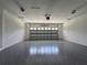 Spacious garage features sealed floors and plenty of overhead lighting at 814 Gator Ln, Deltona, FL 32738
