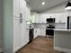 Spacious kitchen with white cabinets, stainless steel appliances, and ample storage at 814 Gator Ln, Deltona, FL 32738