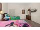Bright shared bedroom featuring cartoon beddings, natural light, and functional furniture at 9055 Treasure Trove Ln # 409, Kissimmee, FL 34747
