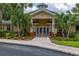 Inviting clubhouse with beautiful landscaping and well-maintained exterior in a sunny community at 9055 Treasure Trove Ln # 409, Kissimmee, FL 34747