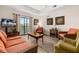 Inviting living room with modern flooring, comfortable seating, and a bright airy atmosphere at 9055 Treasure Trove Ln # 409, Kissimmee, FL 34747