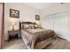 Warm and inviting main bedroom with generous closet space, a full bed, and modern decor at 9055 Treasure Trove Ln # 409, Kissimmee, FL 34747
