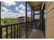 Charming patio featuring serene views of lush landscaping and a building exterior at 9055 Treasure Trove Ln # 409, Kissimmee, FL 34747