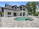 Gorgeous backyard with a refreshing pool, spa and a spacious patio perfect for outdoor entertaining and relaxation at 9799 Covent Garden Dr, Orlando, FL 32827