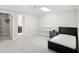 Bright bedroom featuring modern furnishings and a spacious layout with closet and bathroom access at 9799 Covent Garden Dr, Orlando, FL 32827