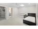 Bright bedroom featuring modern furnishings and a spacious layout with closet and bathroom access at 9799 Covent Garden Dr, Orlando, FL 32827