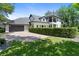 Stunning two-story home featuring a manicured front lawn and a spacious driveway leading to a two-car garage at 9799 Covent Garden Dr, Orlando, FL 32827