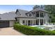 Stunning two-story home featuring a gray roof, balcony, and an attached two car garage at 9799 Covent Garden Dr, Orlando, FL 32827