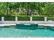Relax and unwind in this backyard oasis featuring a pool, spa, and serene landscaping at 9799 Covent Garden Dr, Orlando, FL 32827