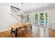 Bright staircase leads to a dining area with a view of the outdoor pool and patio at 9799 Covent Garden Dr, Orlando, FL 32827