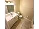 Bright bathroom featuring vanity with storage, toilet, and a shower-tub combo at 1001 Plantation Dr # E1, Kissimmee, FL 34741
