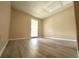 Well-lit bedroom with a large window, neutral walls, and modern laminate flooring for a clean, updated look at 1001 Plantation Dr # E1, Kissimmee, FL 34741