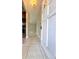 Entryway showing the front door with view into the kitchen and living space at 1001 Plantation Dr # E1, Kissimmee, FL 34741