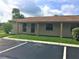 Charming single-story home with a cozy front porch, lush green lawn, and an inviting entrance at 1001 Plantation Dr # E1, Kissimmee, FL 34741