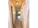 Hallway view with closet space and a view of the bedroom window at 1001 Plantation Dr # E1, Kissimmee, FL 34741