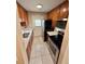 Efficient kitchen featuring stainless steel appliances, modern countertops and wooden cabinets at 1001 Plantation Dr # E1, Kissimmee, FL 34741