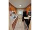 Efficient kitchen featuring stainless steel appliances, modern countertops and wooden cabinets at 1001 Plantation Dr # E1, Kissimmee, FL 34741