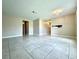 Spacious living room with tile flooring, neutral paint, and natural light at 1001 Plantation Dr # E1, Kissimmee, FL 34741