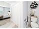 A bathroom featuring a shower with a curtain and a view of the bedroom through an open doorway at 1015 Andean Ln, Davenport, FL 33837