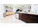 The kitchen area features sleek countertops, modern appliances, and is connected to the living room at 1015 Andean Ln, Davenport, FL 33837