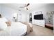 A main bedroom with neutral tones, carpet, and a view of the en-suite bathroom at 1015 Andean Ln, Davenport, FL 33837
