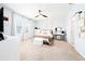 A serene main bedroom with a ceiling fan, carpet flooring, and natural light from the window at 1015 Andean Ln, Davenport, FL 33837