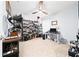 Well-lit home office featuring neutral walls, a ceiling fan, and ample shelving at 1015 Andean Ln, Davenport, FL 33837