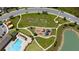 Aerial view highlighting the community playground, pool, green spaces, and walking paths at 1015 Andean Ln, Davenport, FL 33837