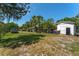 Expansive backyard features mature trees, a shed, and plenty of space for gardening or recreation at 1096 Dyson Dr, Winter Springs, FL 32708