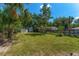 Spacious backyard with mature trees and a storage shed offers plenty of room for outdoor activities at 1096 Dyson Dr, Winter Springs, FL 32708