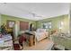 Bright bedroom with large windows, neutral colors, and ceiling fan at 1096 Dyson Dr, Winter Springs, FL 32708