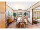 Bright dining room with wood floors and stylish light fixture at 1096 Dyson Dr, Winter Springs, FL 32708