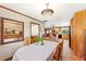 Open concept dining room area featuring a vintage style light fixture and a doorway looking into the kitchen at 1096 Dyson Dr, Winter Springs, FL 32708