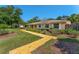 Inviting single-story home featuring a colorful pathway, manicured landscaping, and classic exterior design at 1096 Dyson Dr, Winter Springs, FL 32708