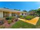 Beautiful house with brick accents, covered porch, and landscaped garden, featuring a bright yellow walkway at 1096 Dyson Dr, Winter Springs, FL 32708