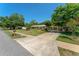 Charming single story home with a spacious driveway, lush green lawn, and mature trees on a sunny day at 1096 Dyson Dr, Winter Springs, FL 32708