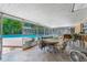 Screened patio with a pool view provides an ideal space for relaxation and entertaining at 1096 Dyson Dr, Winter Springs, FL 32708