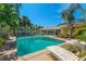 Inviting pool with sun loungers offers a serene retreat for relaxing and soaking up the sun at 1096 Dyson Dr, Winter Springs, FL 32708