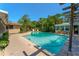 Resort-style pool surrounded by lush landscaping offers a private oasis for relaxation and recreation at 1096 Dyson Dr, Winter Springs, FL 32708