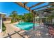 Beautiful pool with lush tropical surroundings creates a private and inviting outdoor space at 1096 Dyson Dr, Winter Springs, FL 32708
