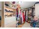 This walk-in closet is fully outfitted with shelves, hanging racks, and drawers at 1096 Dyson Dr, Winter Springs, FL 32708