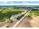 Scenic aerial view of a community near a lake, showcasing a blend of natural landscapes and residential development at 1096 Roberta Rd, Lake Wales, FL 33853