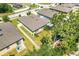 Aerial view of the property highlighting its well-maintained yard, privacy fence, and proximity to mature trees at 1096 Roberta Rd, Lake Wales, FL 33853
