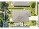 Aerial view showcasing the home's roof, landscaping, and surrounding neighborhood at 1096 Roberta Rd, Lake Wales, FL 33853