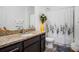 Well-appointed bathroom with modern fixtures, a granite countertop, and a shower with decorative curtains at 1096 Roberta Rd, Lake Wales, FL 33853