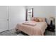 Cozy bedroom with a comfortable bed, neutral walls, and a window offering natural light at 1096 Roberta Rd, Lake Wales, FL 33853